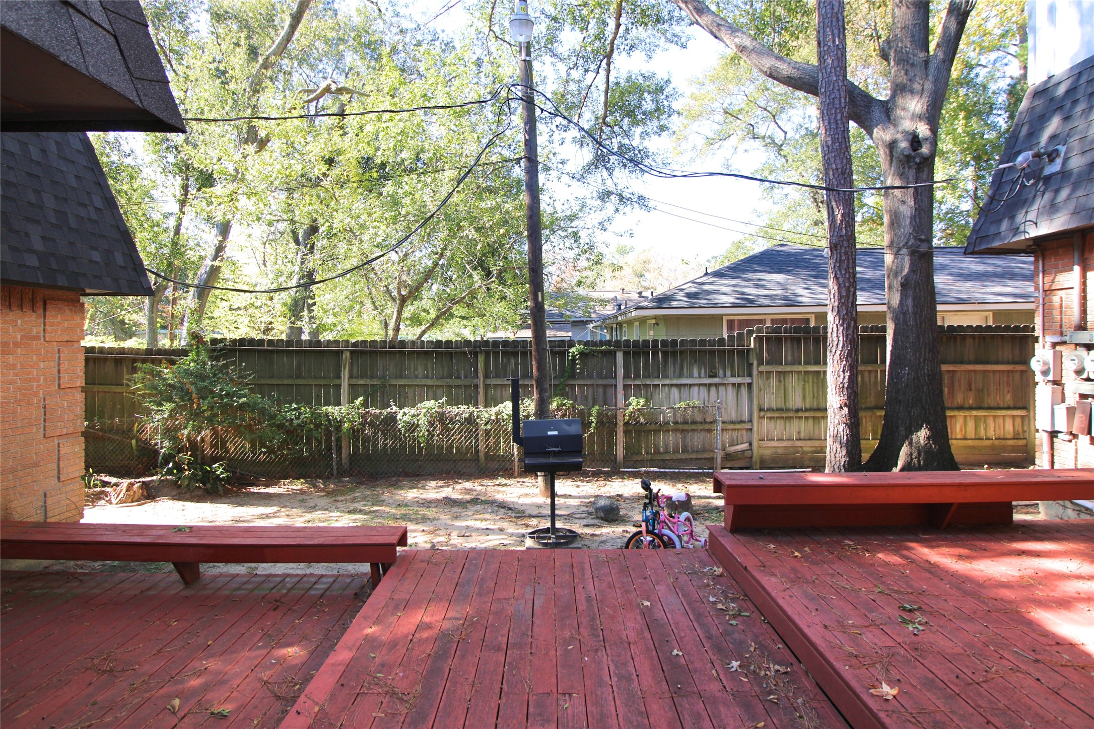 1305 Adams Street, Unit 4 Conroe, TX 77301 - Photo 10 of 13 a view of a house with backyard and sitting area