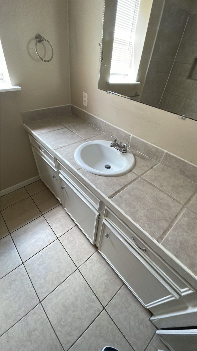 1305 Adams Street, Unit 4 Conroe, TX 77301 - Photo 10 of 32 a bathroom with a sink and a vanity