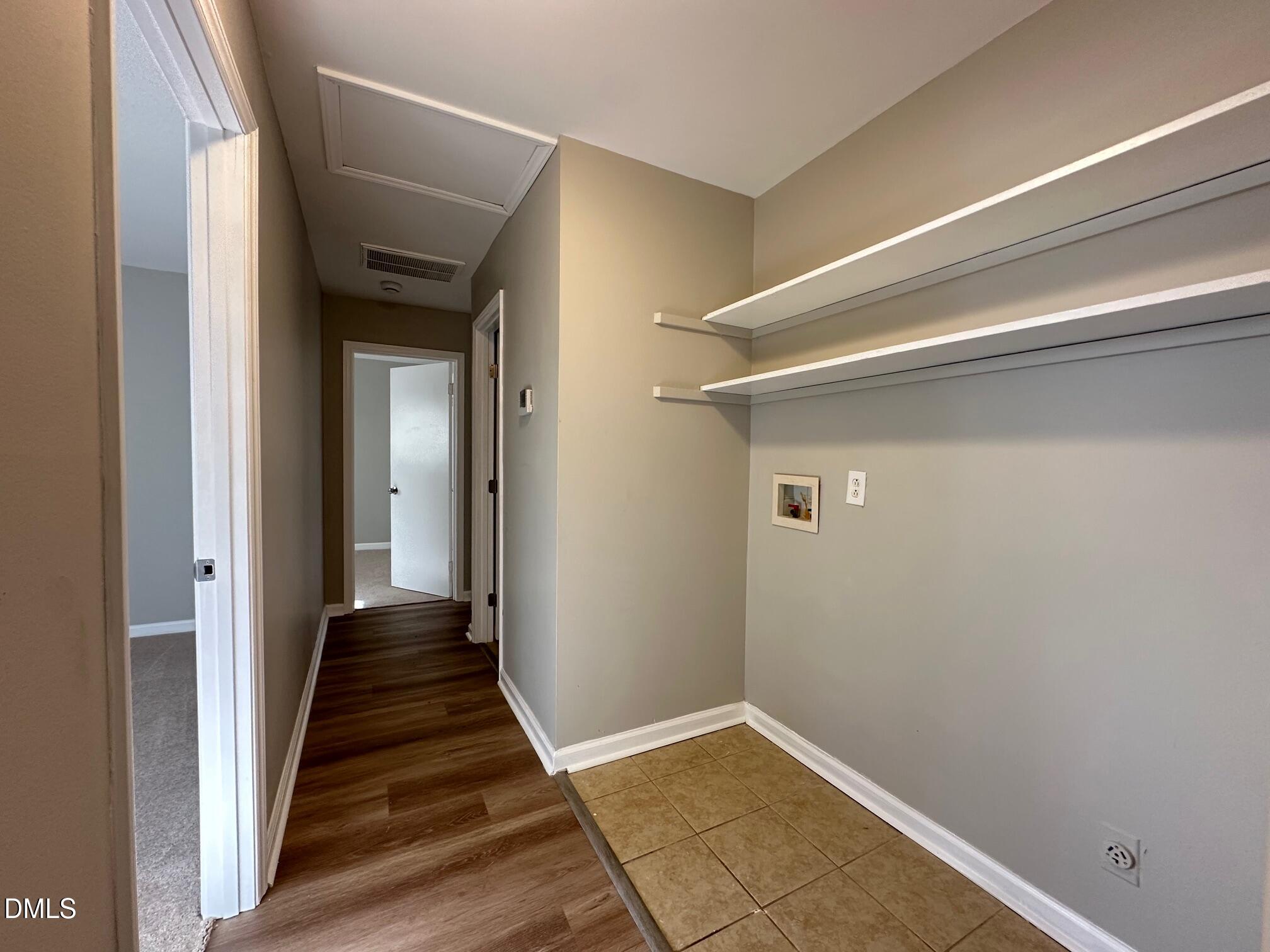 1304 Seabrook Road Raleigh, NC 27610 - Photo 17 of 19 a view of a hallway with wooden floor