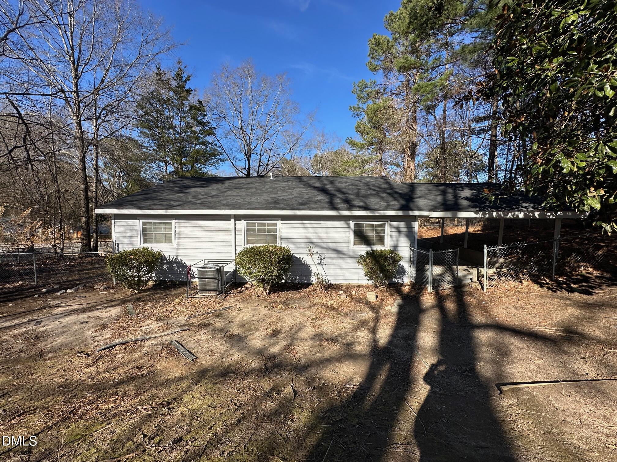 1304 Seabrook Road Raleigh, NC 27610 - Photo 19 of 19 a view of a house with backyard porch and sitting area