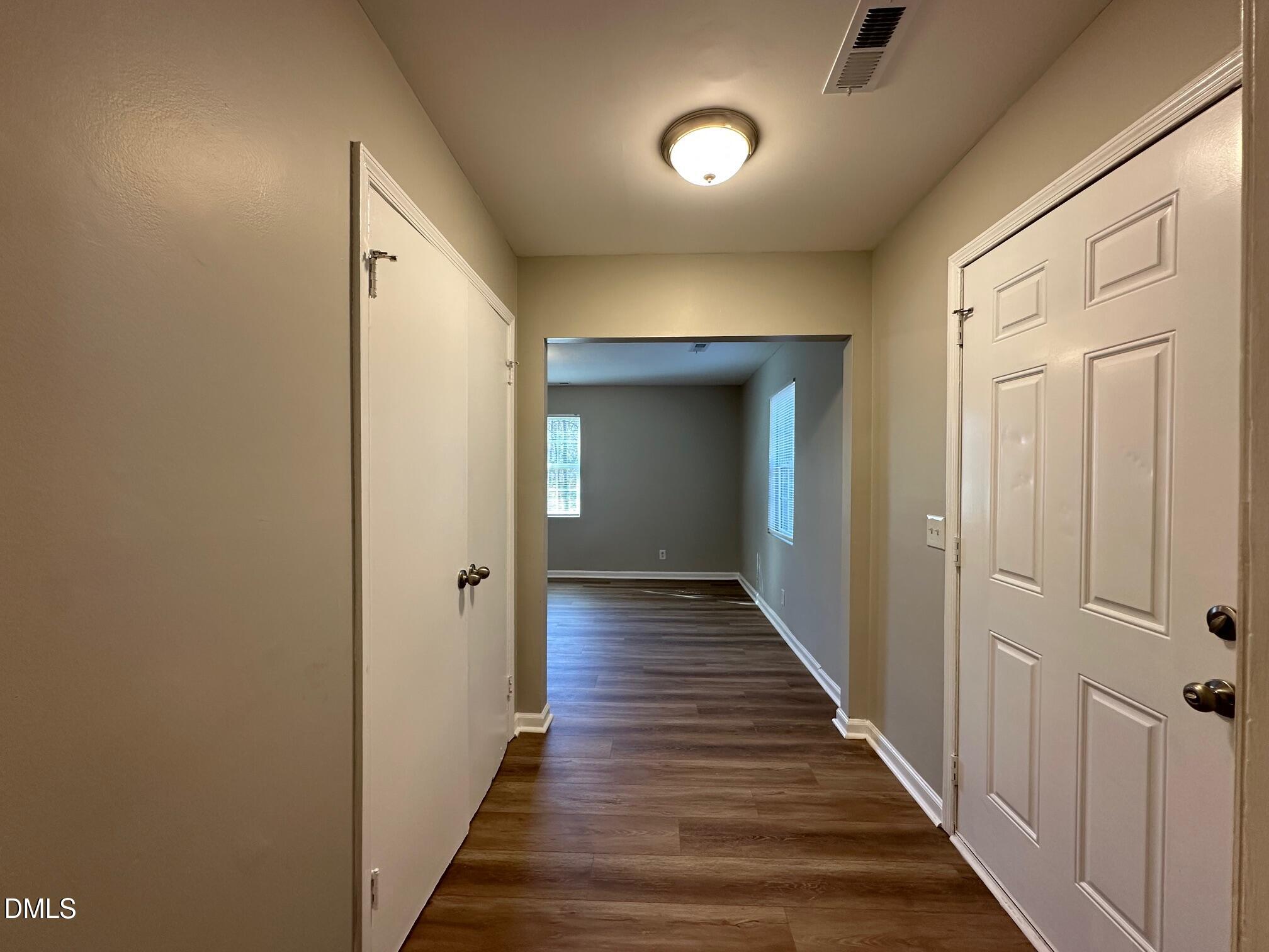1304 Seabrook Road Raleigh, NC 27610 - Photo 4 of 19 a view of a hallway with the wooden floor