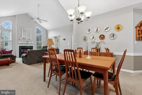a kitchen with stainless steel appliances granite countertop a sink refrigerator and cabinets
