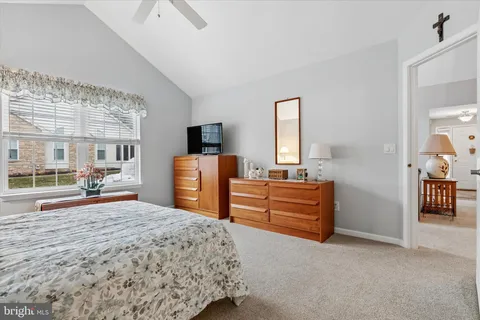 a view of walk in closet with clothes