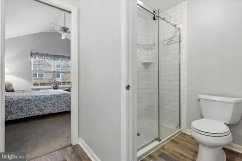 a bedroom with a bed and a television in it