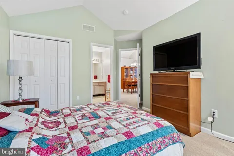 a view of a livingroom with furniture and a ceiling fan