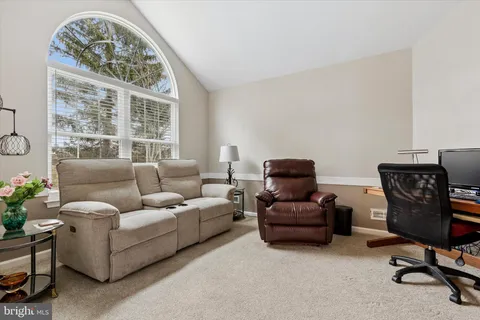 a room with furniture and a flat screen tv