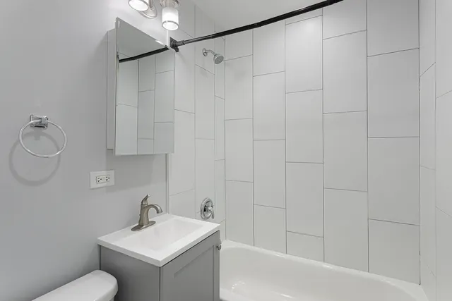 a bathroom with a sink toilet and vanity