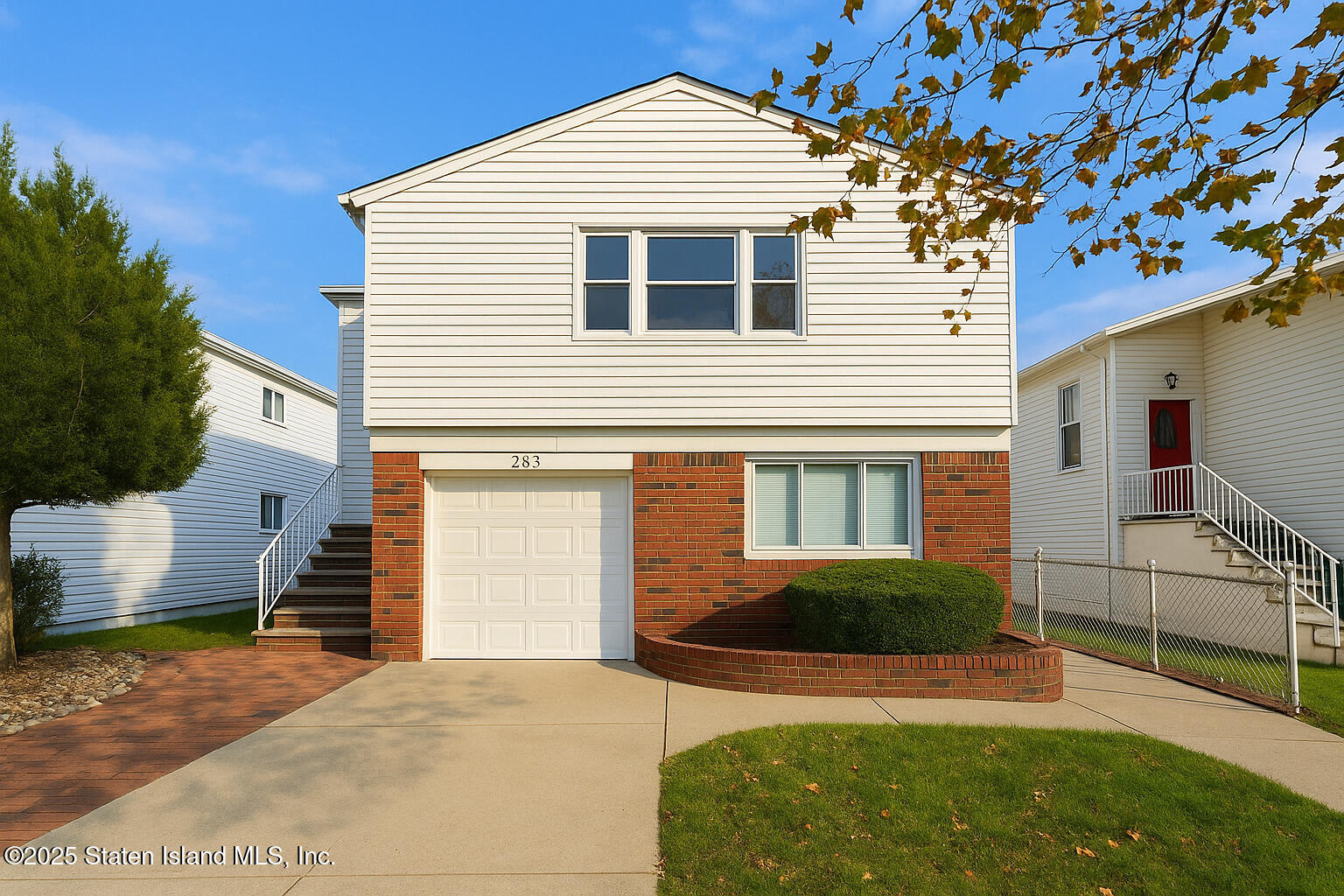 281 Arlene Street Staten Island, NY 10314 - Photo 1 of 42 a front view of a house with a yard and garage