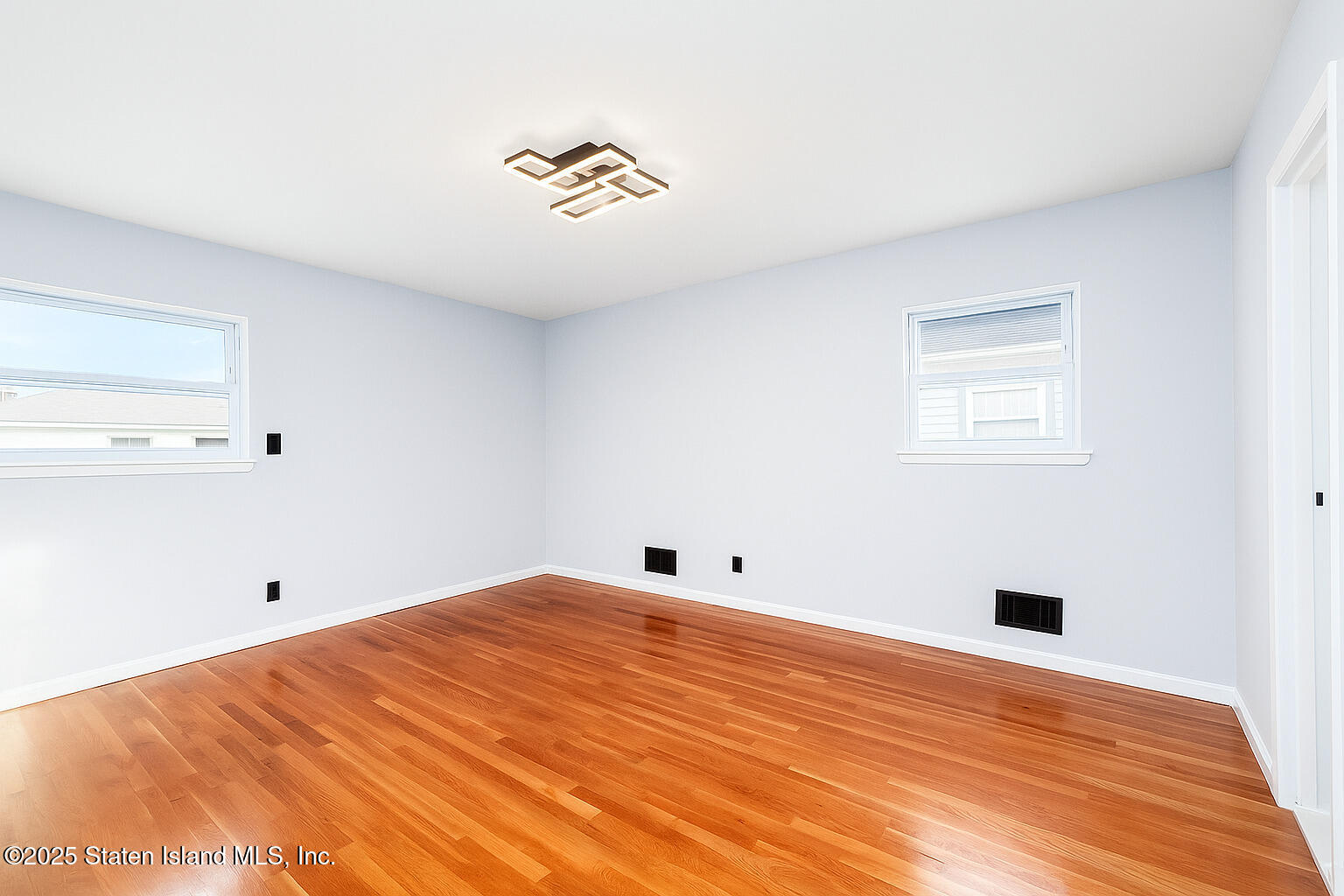281 Arlene Street Staten Island, NY 10314 - Photo 26 of 42 a view of empty room with wooden floor