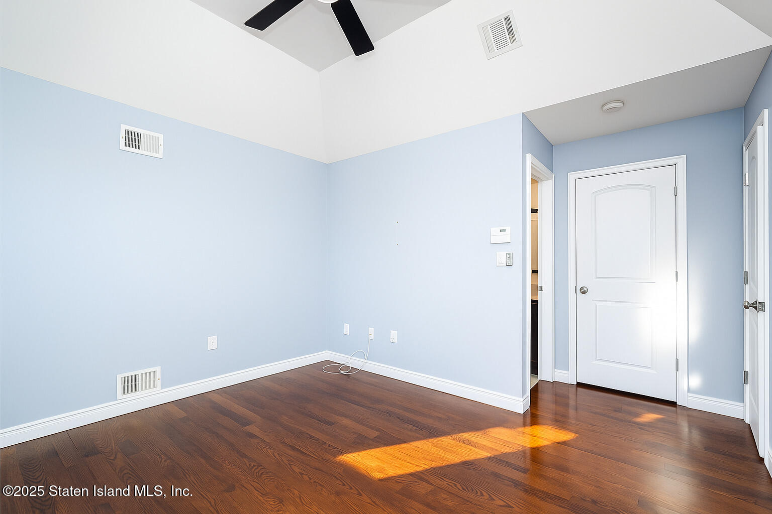 281 Arlene Street Staten Island, NY 10314 - Photo 29 of 42 an empty room with wooden floor and closet