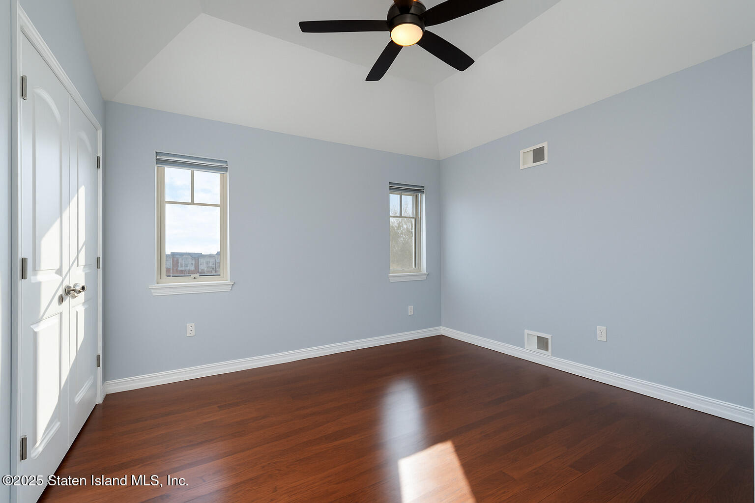 281 Arlene Street Staten Island, NY 10314 - Photo 30 of 42 a view of a room with wooden floor and windows