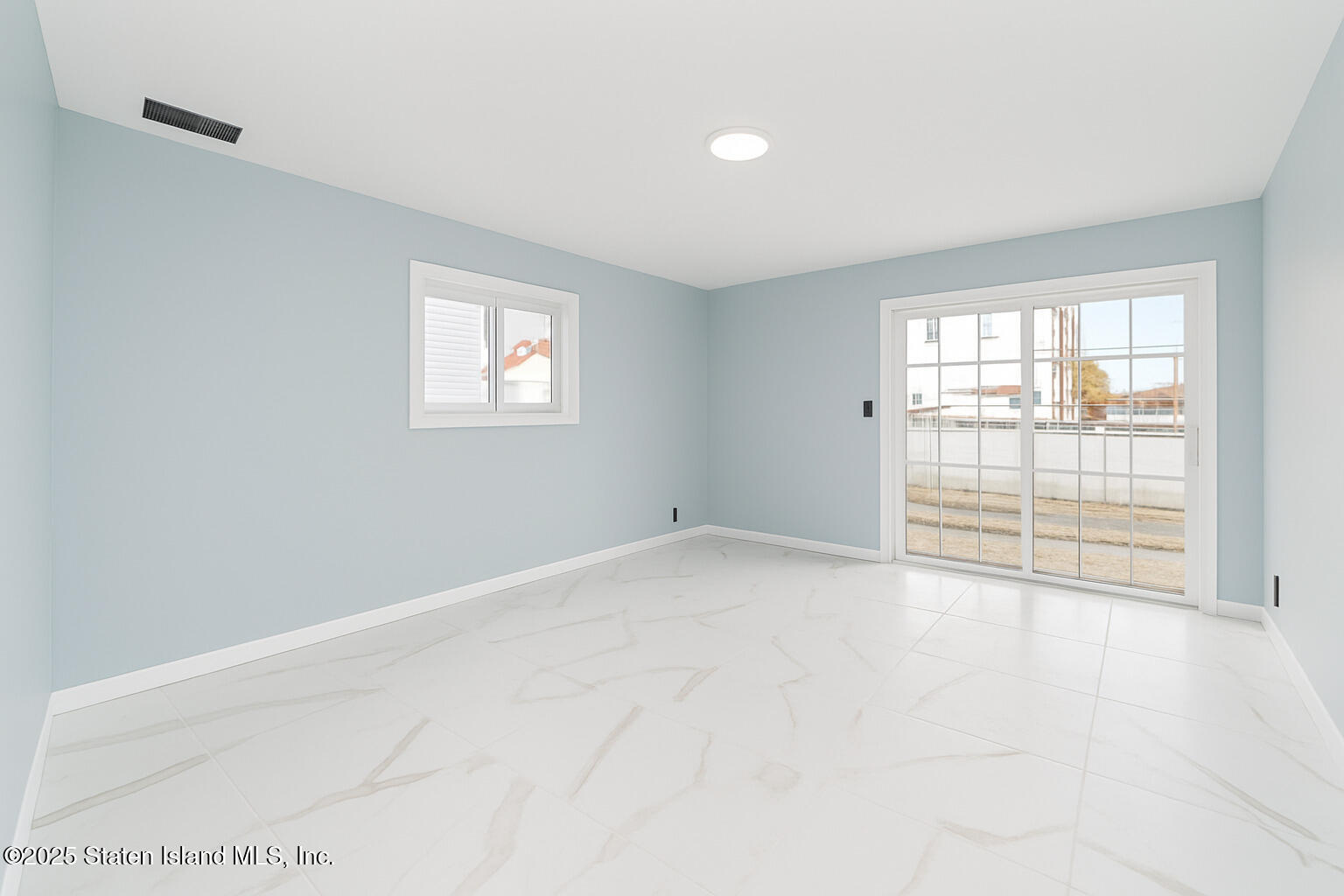 281 Arlene Street Staten Island, NY 10314 - Photo 31 of 42 an empty room with windows