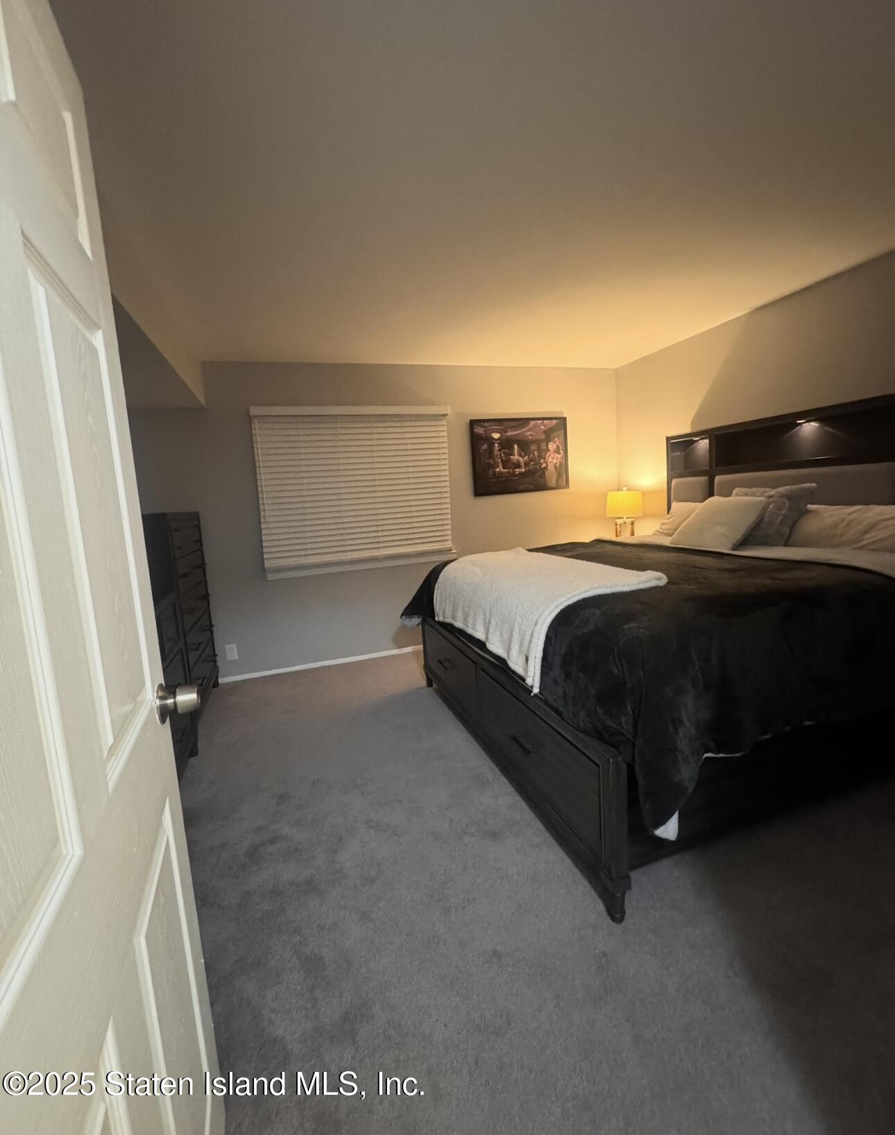 281 Arlene Street Staten Island, NY 10314 - Photo 39 of 42 a bedroom with a bed and a night stand