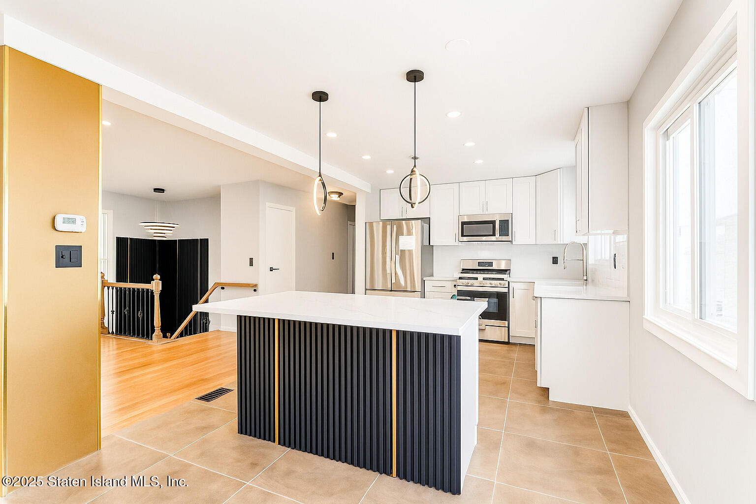 281 Arlene Street Staten Island, NY 10314 - Photo 8 of 42 a kitchen with stainless steel appliances kitchen island granite countertop a sink a stove and cabinets