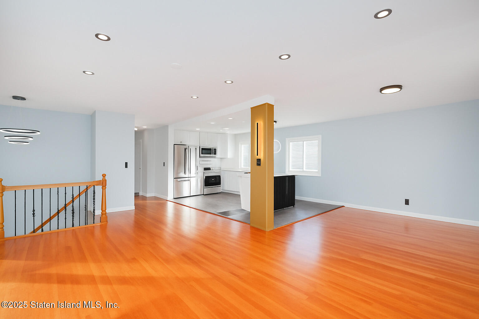 281 Arlene Street Staten Island, NY 10314 - Photo 10 of 42 a view of an empty room with window and wooden floor