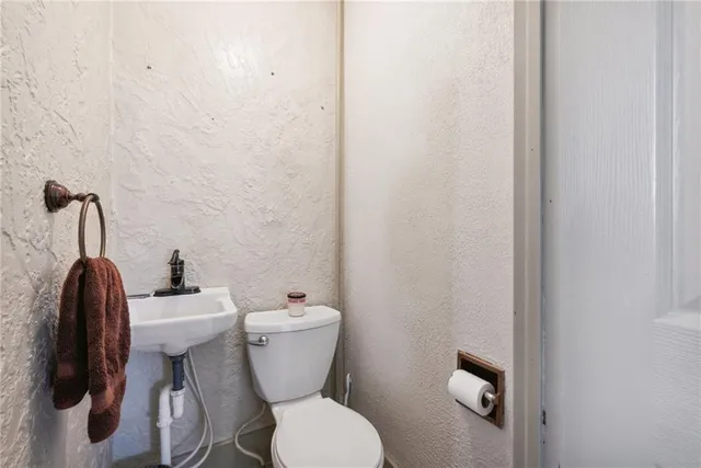 a bathroom with a toilet and a sink