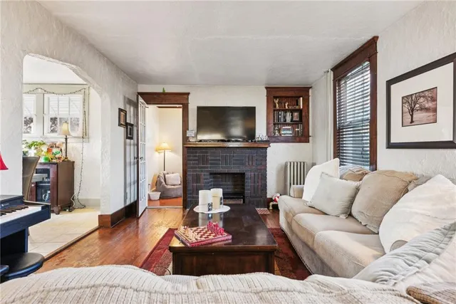 a living room with furniture or couch and a fireplace