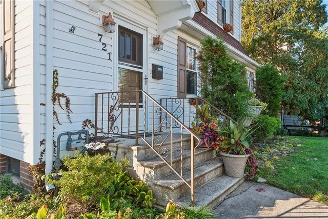 a view of a house with a flower garden