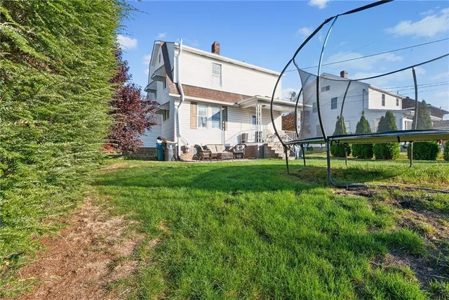 a view of a back yard of the house