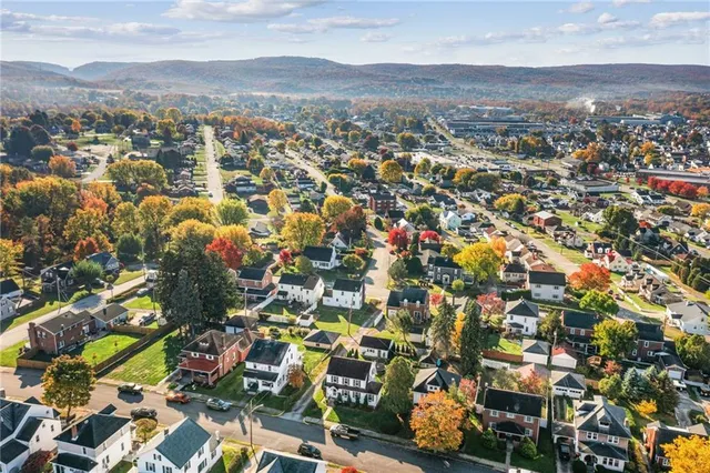 an aerial view of residential houses with outdoor space
