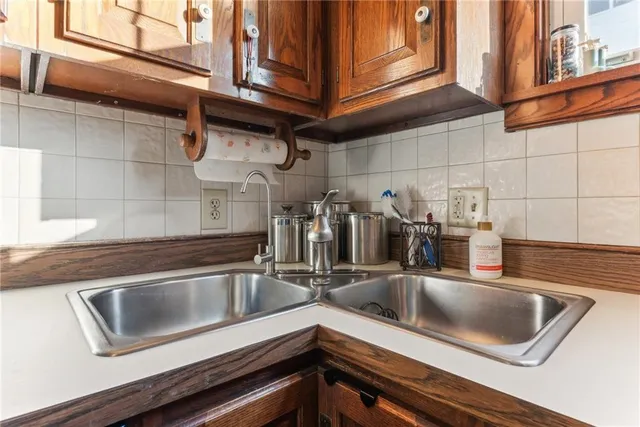 a kitchen with a sink and cabinets
