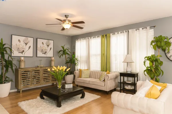 a living room with furniture and a large window