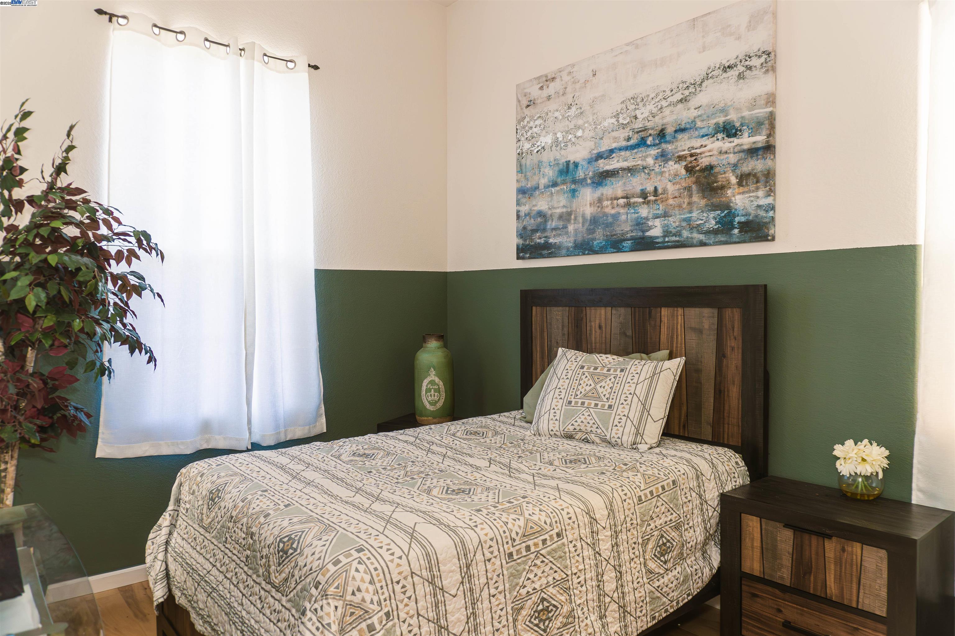 7064 Alder Creek Road Vallejo, CA 94591 - Photo 9 of 14 a bedroom with a bed and a window