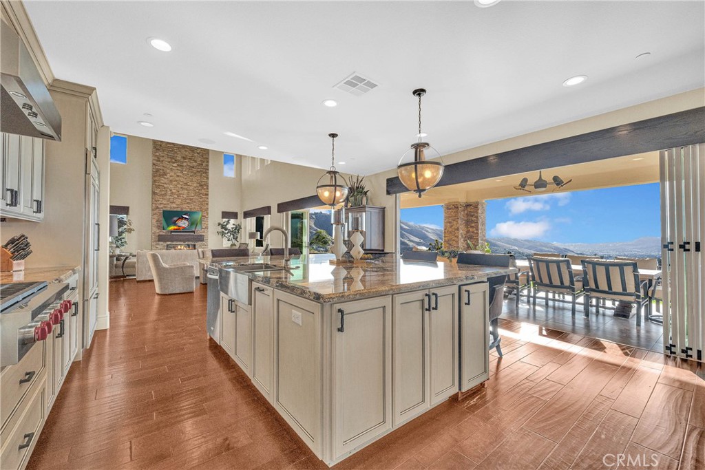 16727 Pienza Court Riverside, CA 92503 - Photo 18 of 41 Folding glass walls open the kitchen fully to the California room