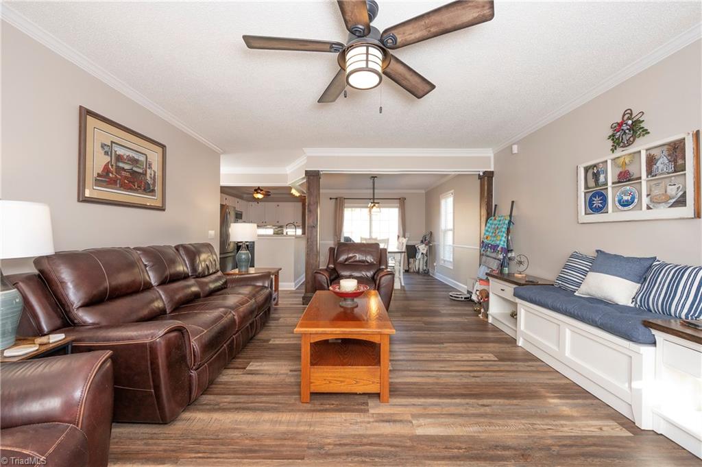 5870 Ferntree Court Pfafftown, NC 27040 - Photo 6 of 28 Living room, dining room and kitchen are all open and connected