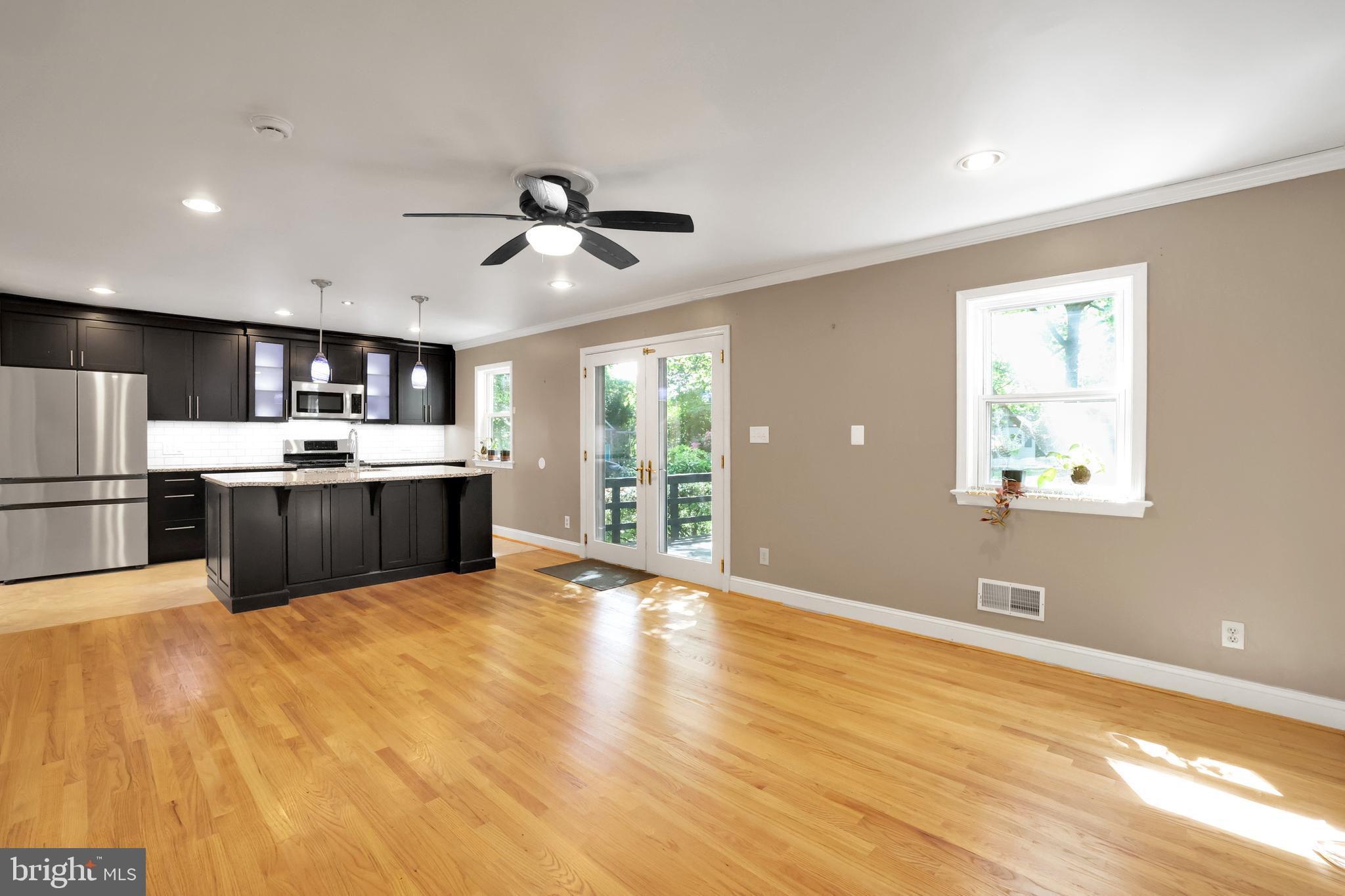 5807 Carlyle Street Cheverly, MD 20785 - Photo 27 of 58 a view of kitchen with wooden floor and window
