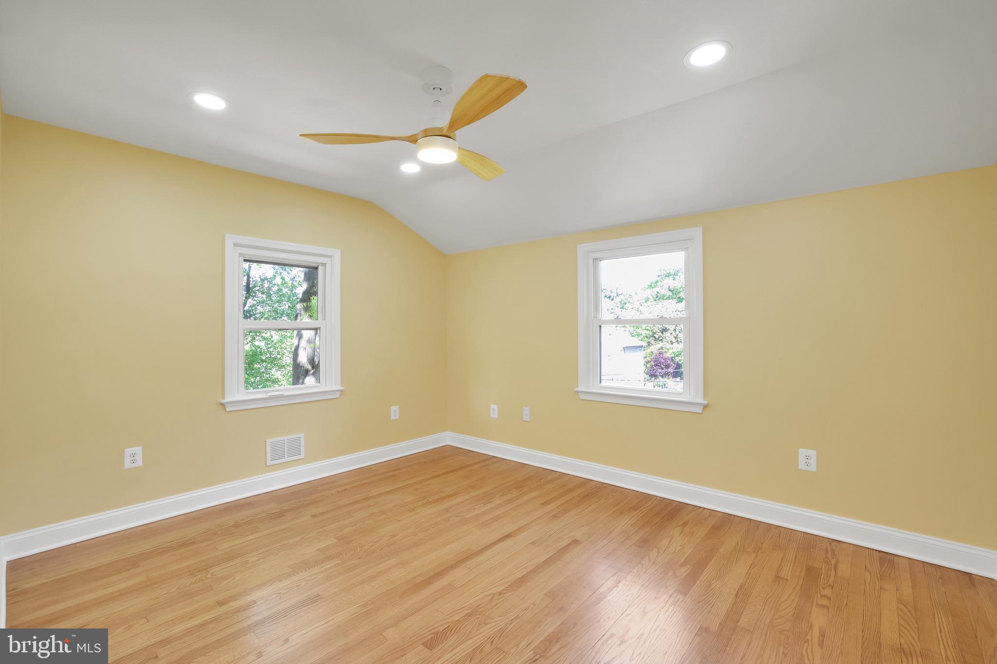 5807 Carlyle Street Cheverly, MD 20785 - Photo 37 of 58 a view of an empty room with window and wooden floor