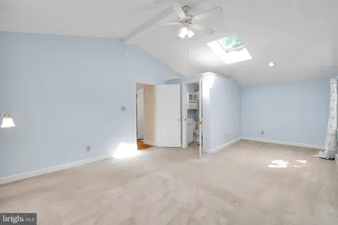 a view of an empty room with a fireplace