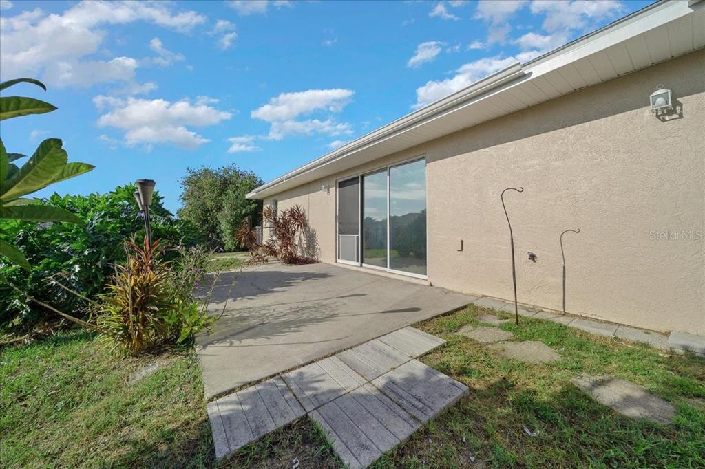 12205 Southeast 100th Court Belleview, FL 34420 - Photo 13 of 73 a view of a house with backyard and garden