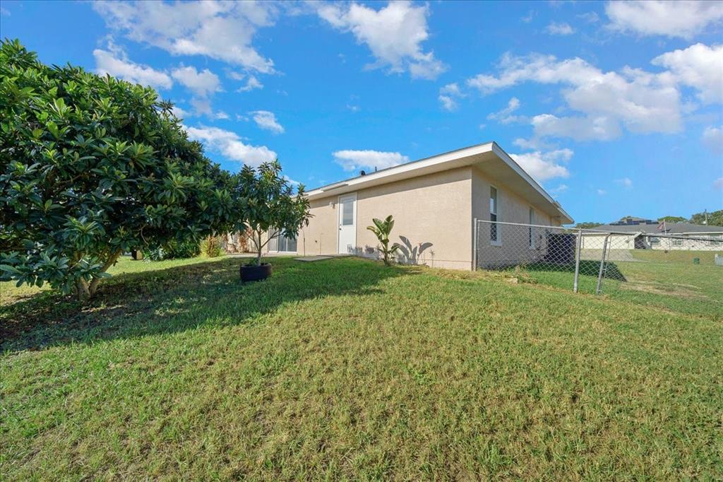 12205 Southeast 100th Court Belleview, FL 34420 - Photo 14 of 73 a view of a house with a yard