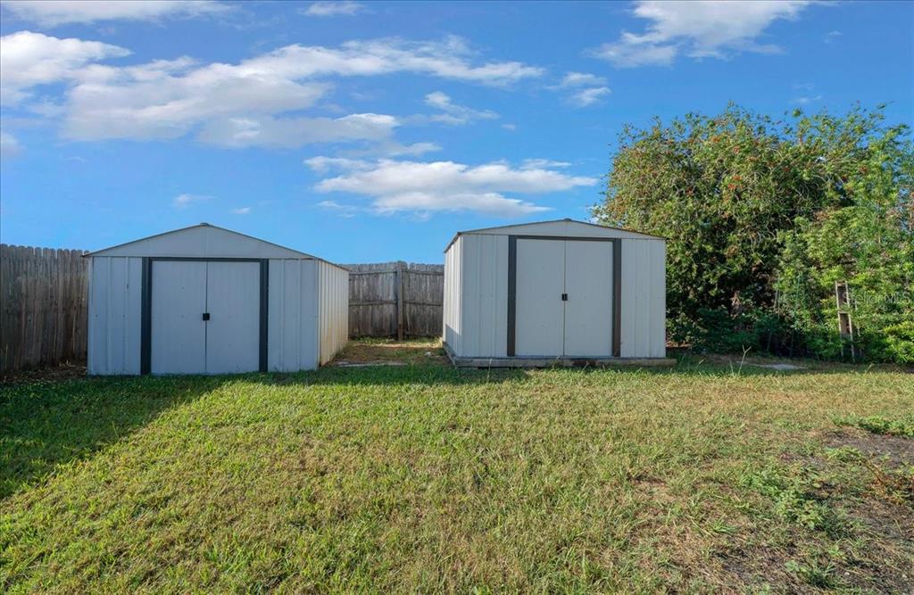 12205 Southeast 100th Court Belleview, FL 34420 - Photo 19 of 73 a backyard of a house with lots of green space