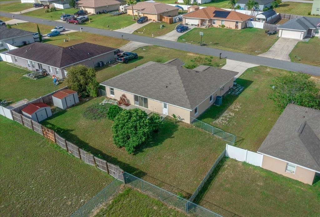 12205 Southeast 100th Court Belleview, FL 34420 - Photo 56 of 73 an aerial view of residential houses with outdoor space and street view