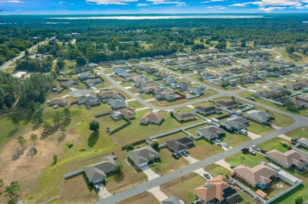 12205 Southeast 100th Court Belleview, FL 34420 - Photo 59 of 73 a view of a yard with an outdoor space