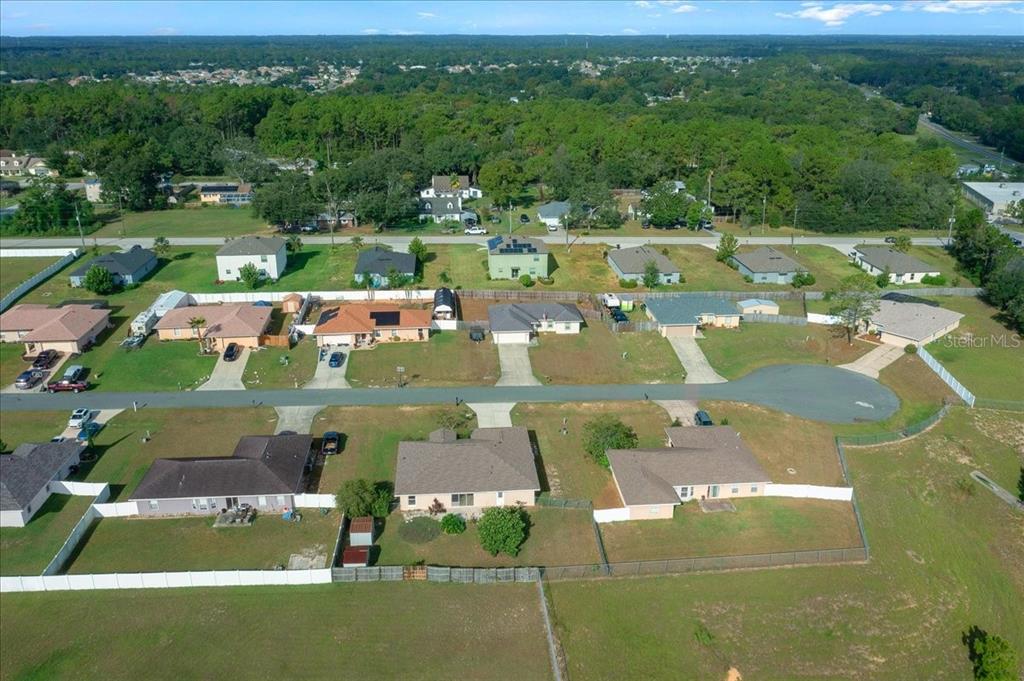 12205 Southeast 100th Court Belleview, FL 34420 - Photo 63 of 73 an aerial view of a house with a yard