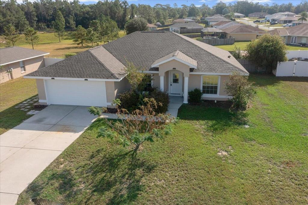 12205 Southeast 100th Court Belleview, FL 34420 - Photo 66 of 73 an aerial view of a house