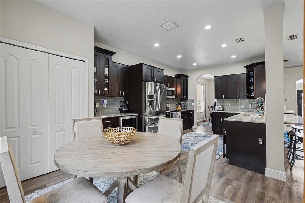 1952 Fruitridge Street Brandon, FL 33510 - Photo 13 of 39 a kitchen with refrigerator and cabinets