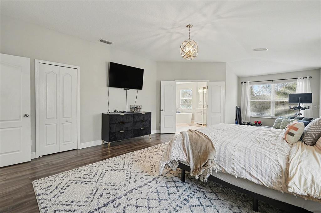 1952 Fruitridge Street Brandon, FL 33510 - Photo 22 of 39 a bed room with a bed a television and dresser