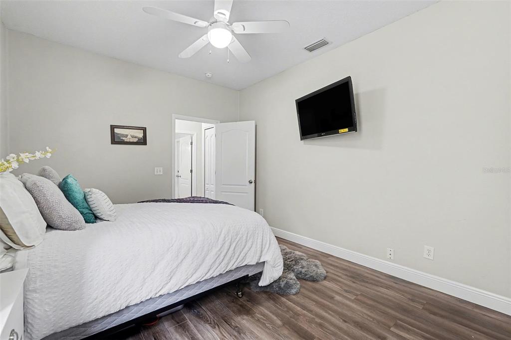 1952 Fruitridge Street Brandon, FL 33510 - Photo 31 of 39 a bedroom with a bed and a flat screen tv