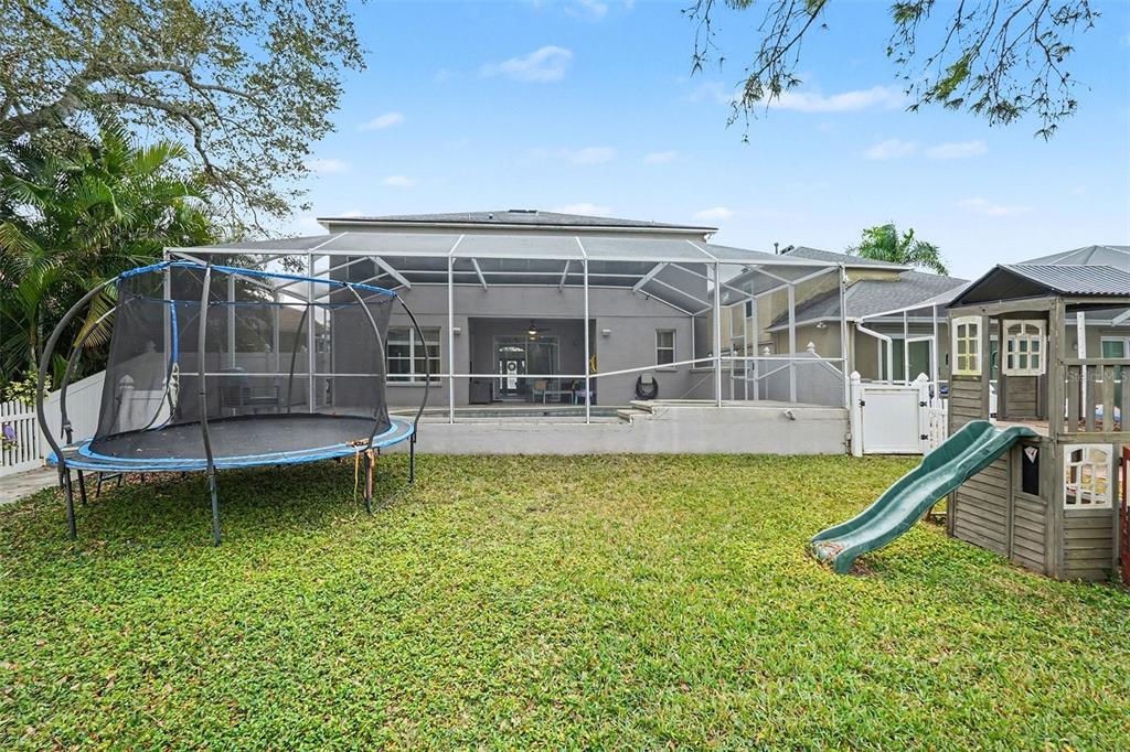 1952 Fruitridge Street Brandon, FL 33510 - Photo 32 of 39 an outdoor view of house with swimming pool