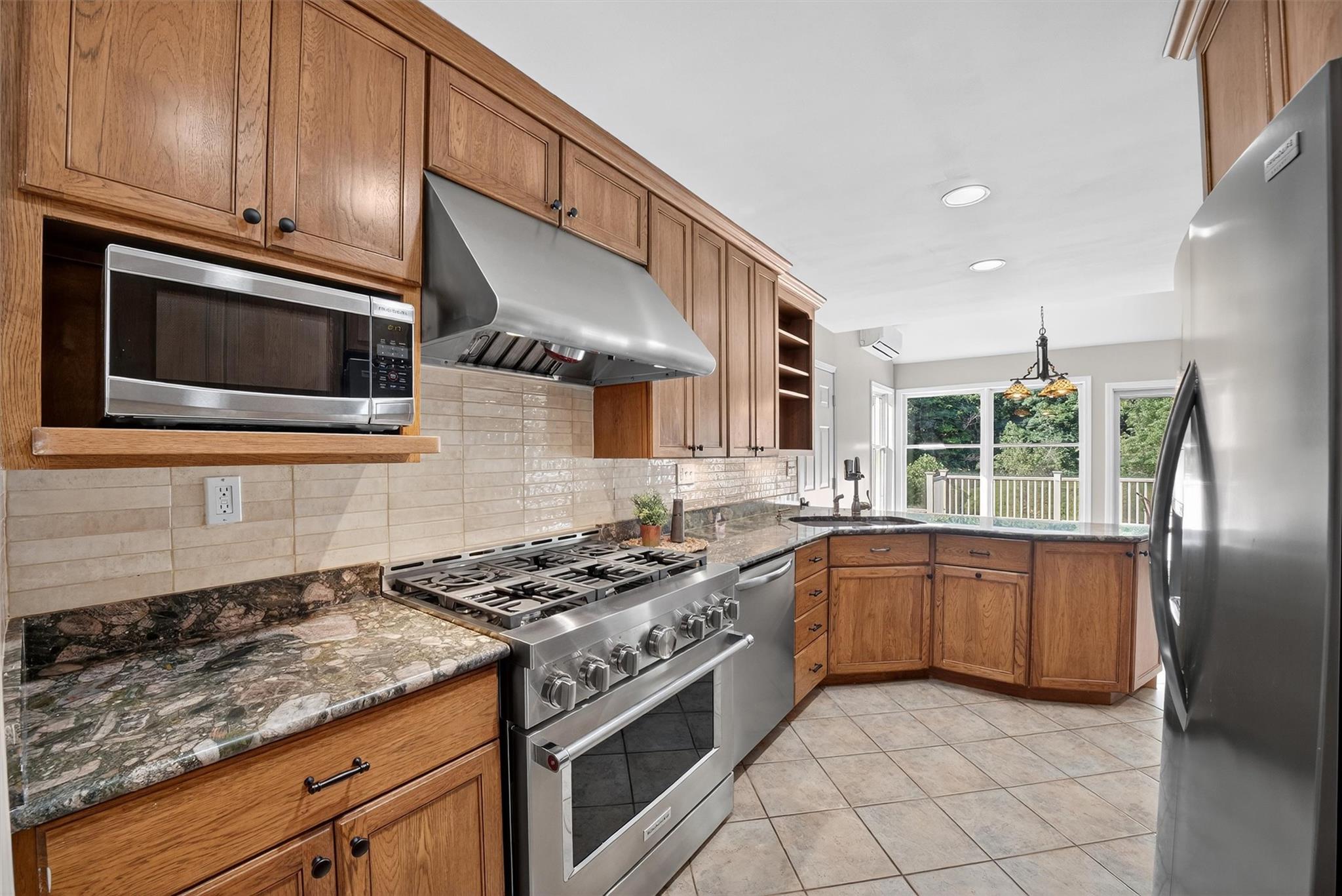 172 Shields Road Red Hook, NY 12571 - Photo 11 of 50 a kitchen with stainless steel appliances granite countertop a stove a sink and a microwave