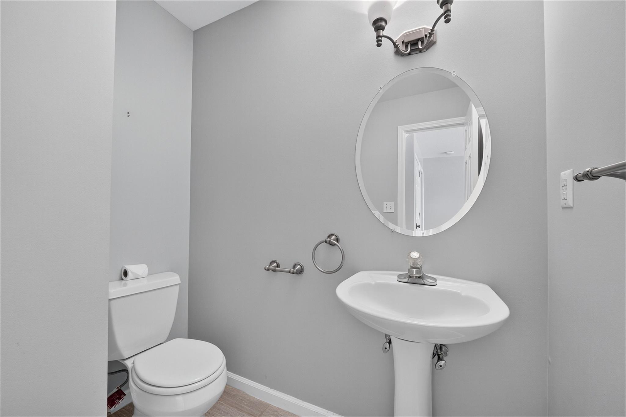 172 Shields Road Red Hook, NY 12571 - Photo 12 of 50 a bathroom with a toilet sink and mirror
