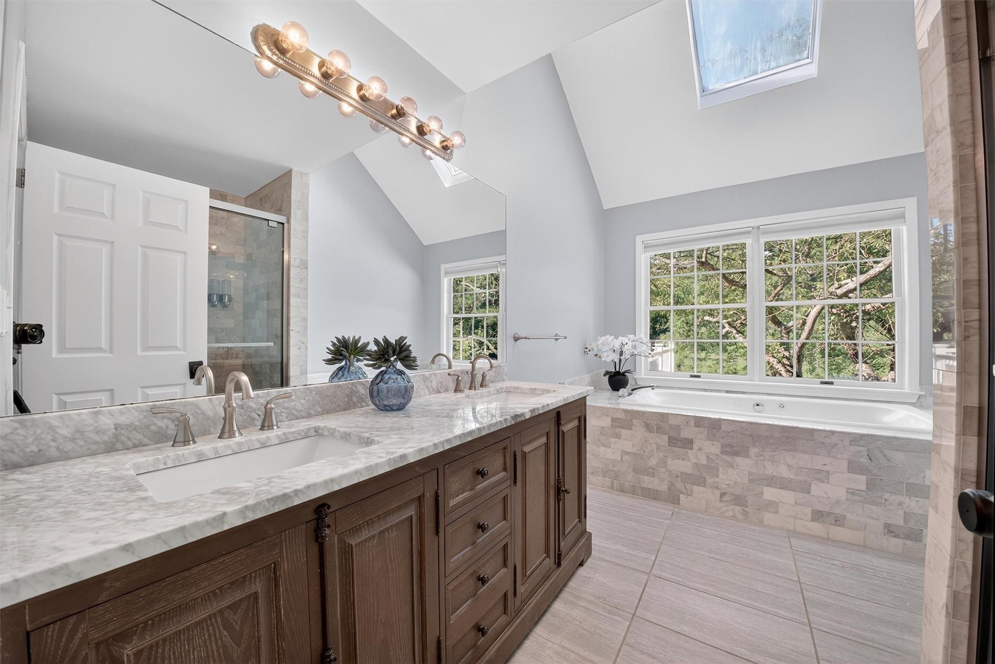 172 Shields Road Red Hook, NY 12571 - Photo 16 of 50 a spacious bathroom with a granite countertop double vanity sink a mirror and a bathtub