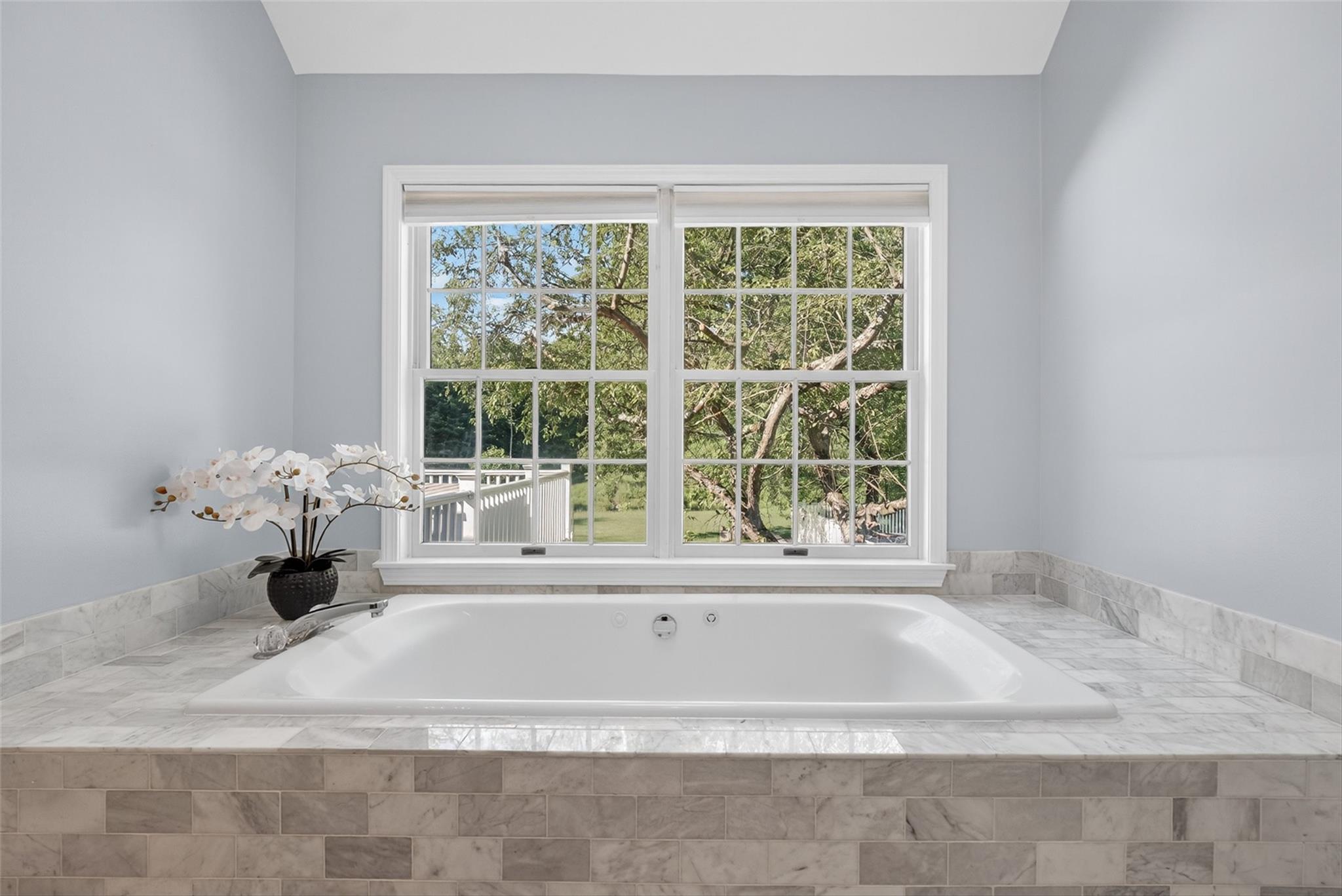 172 Shields Road Red Hook, NY 12571 - Photo 17 of 50 a white bath tub sitting in a bathroom next to a window
