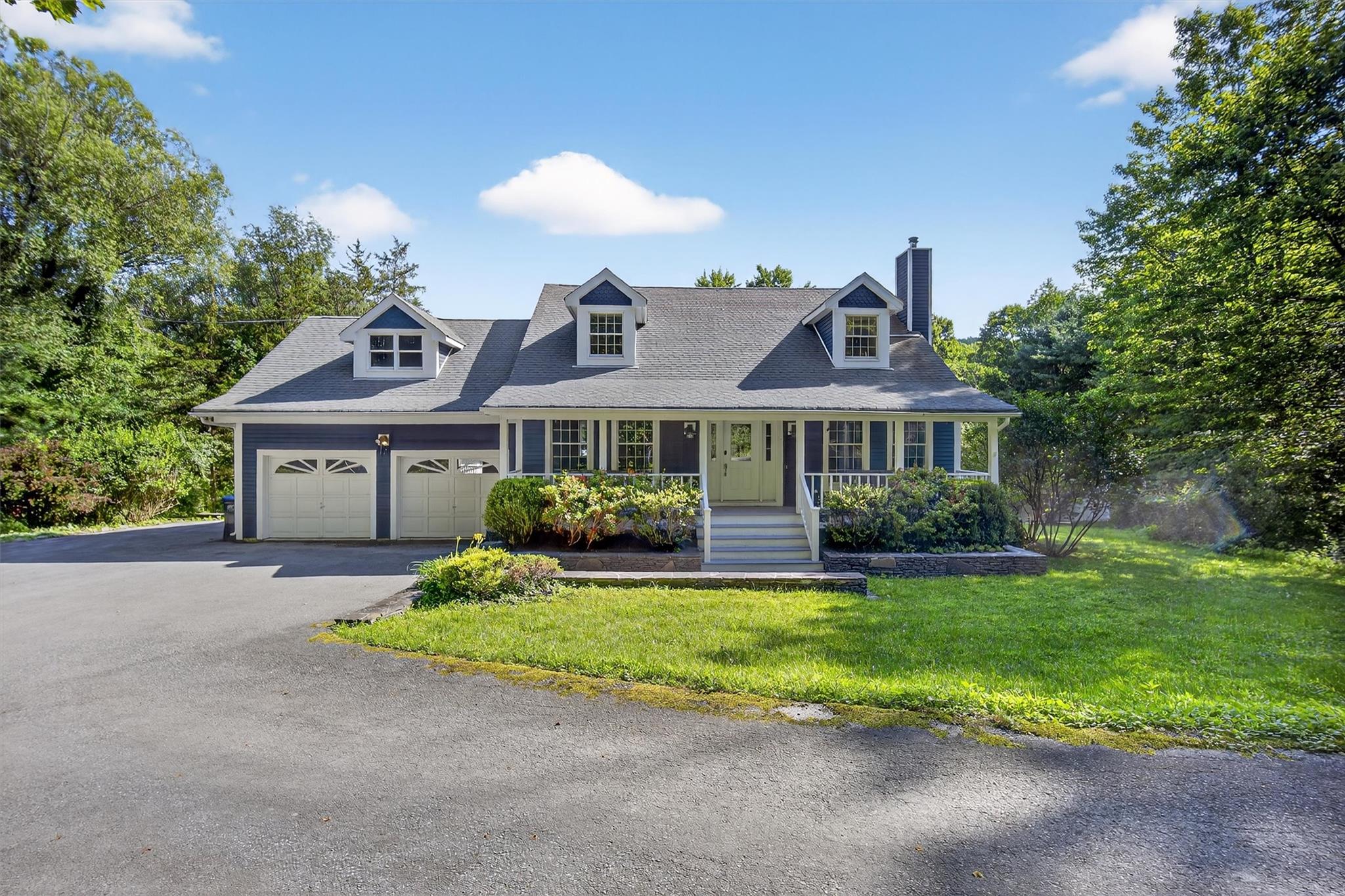172 Shields Road Red Hook, NY 12571 - Photo 2 of 50 a front view of a house with a yard and garage