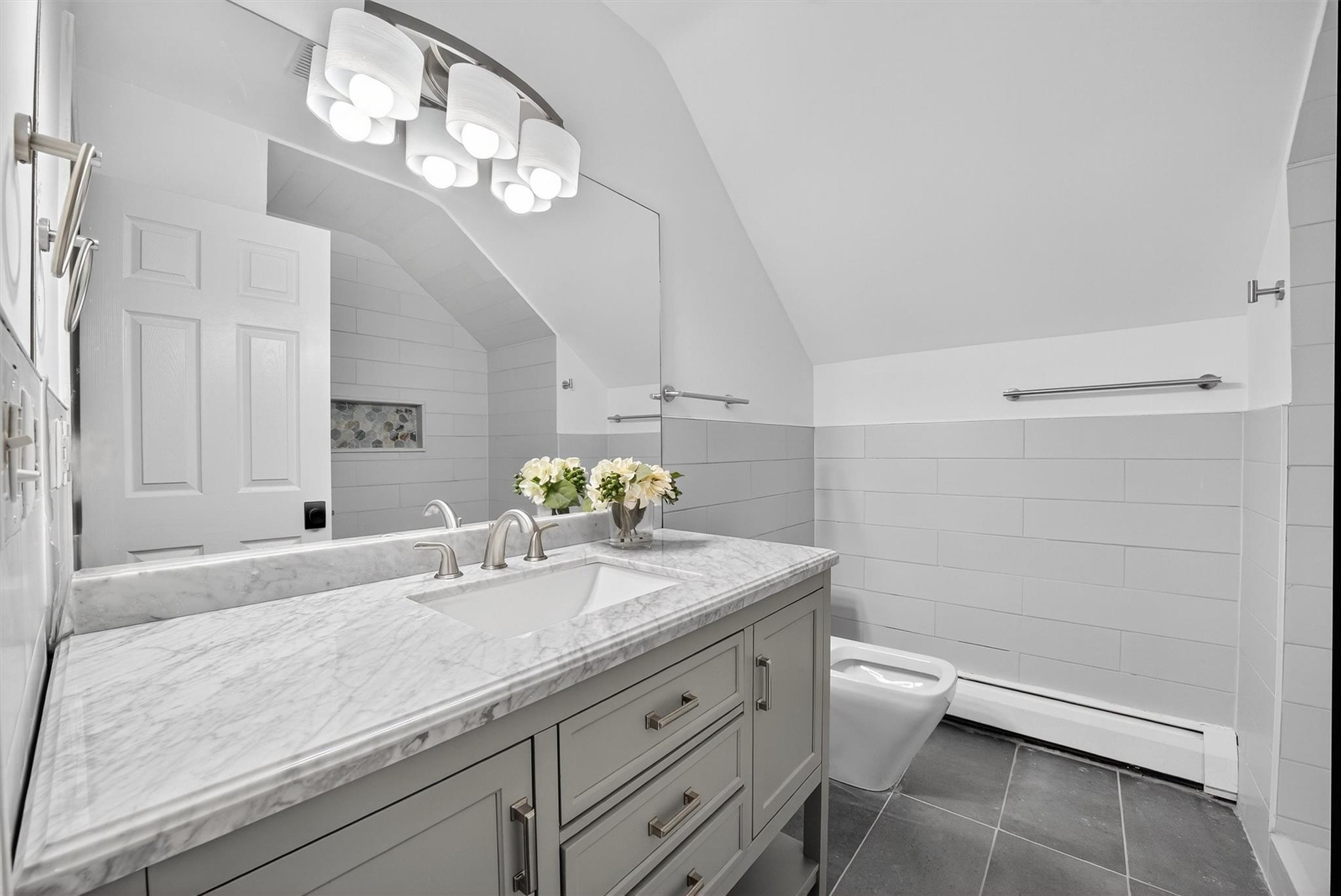 172 Shields Road Red Hook, NY 12571 - Photo 20 of 50 a bathroom with a granite countertop sink a toilet and a mirror