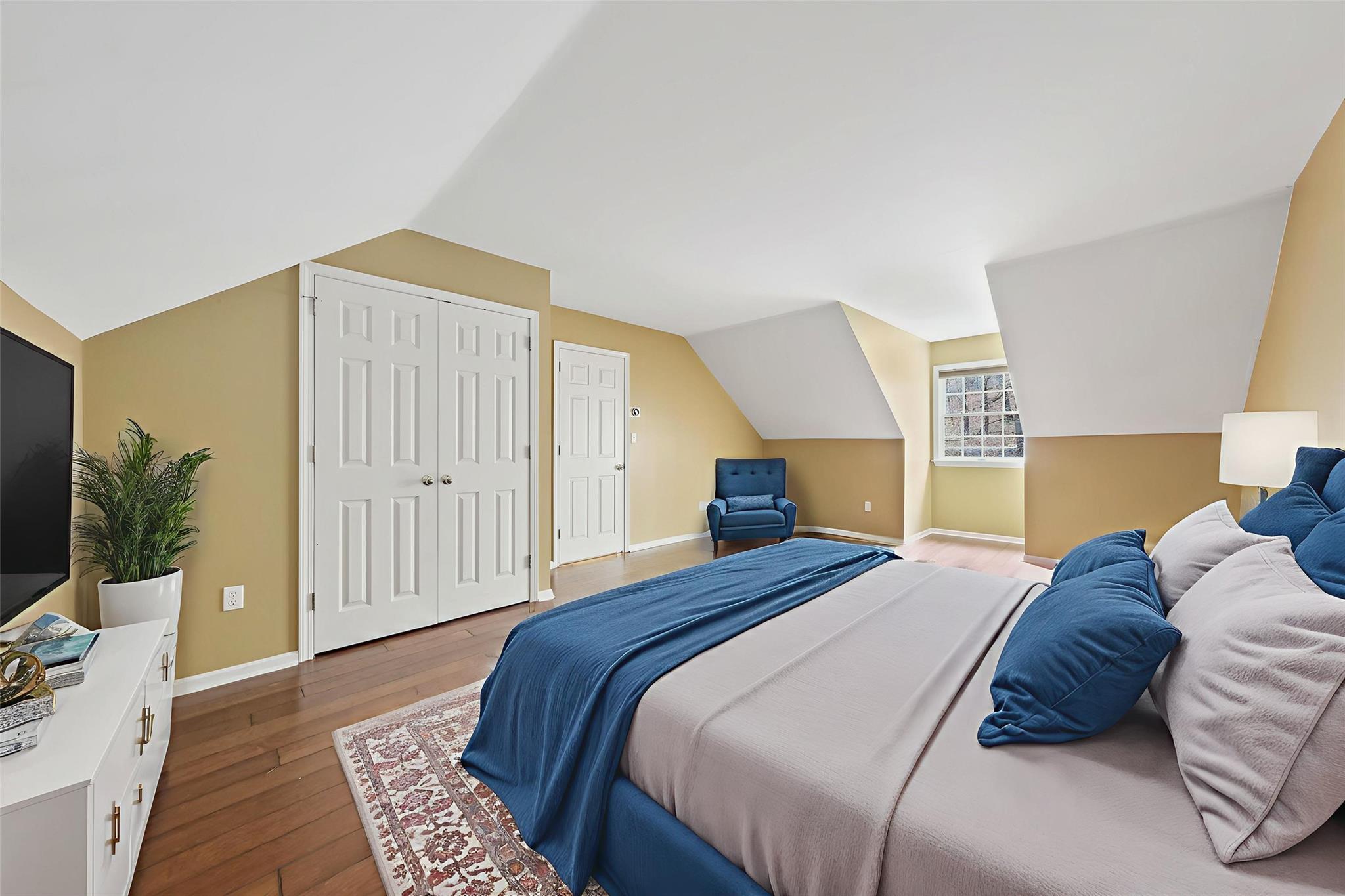 172 Shields Road Red Hook, NY 12571 - Photo 21 of 50 a bedroom with a large bed and a potted plant
